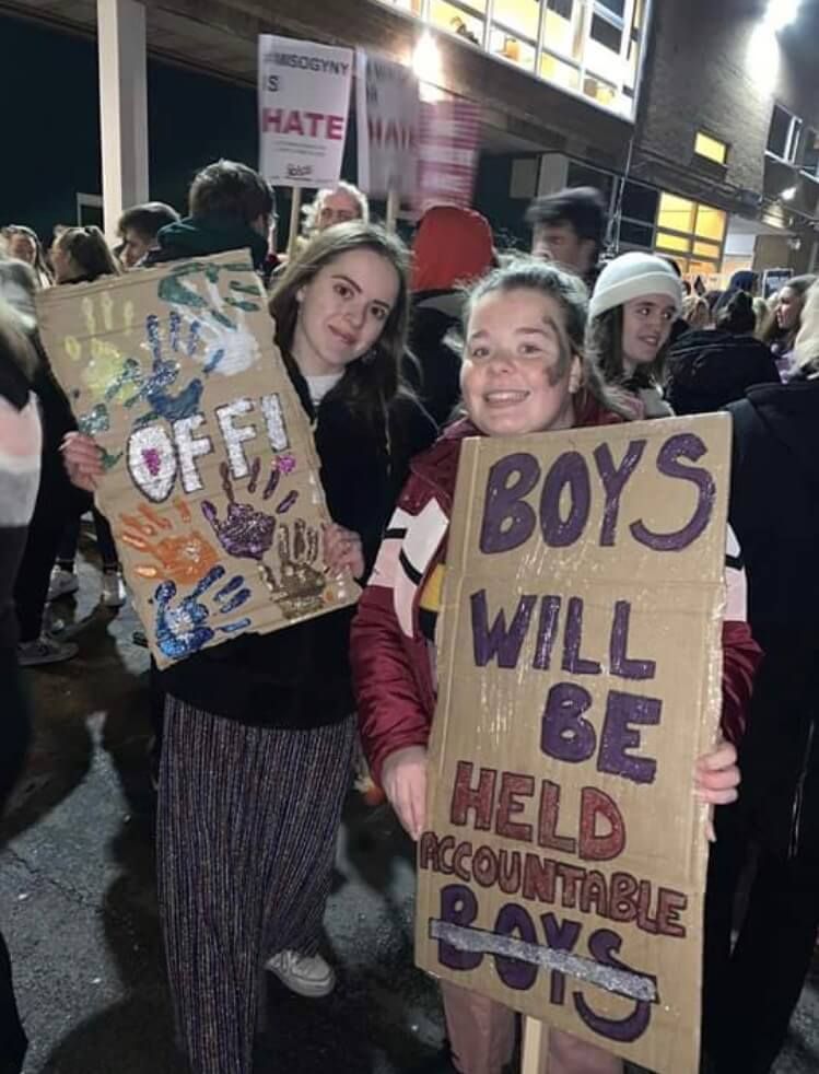 Image may contain: Face, People, Vehicle, Offroad, Transportation, Rally, Female, Text, Protest, Parade, Crowd, Clothing, Apparel, Human, Person