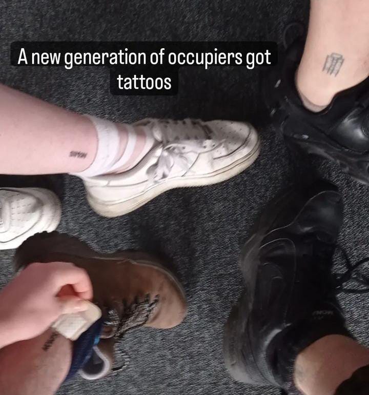 Picture of students with ankle tattoos captioned "A new generation of occupiers got tattoos"