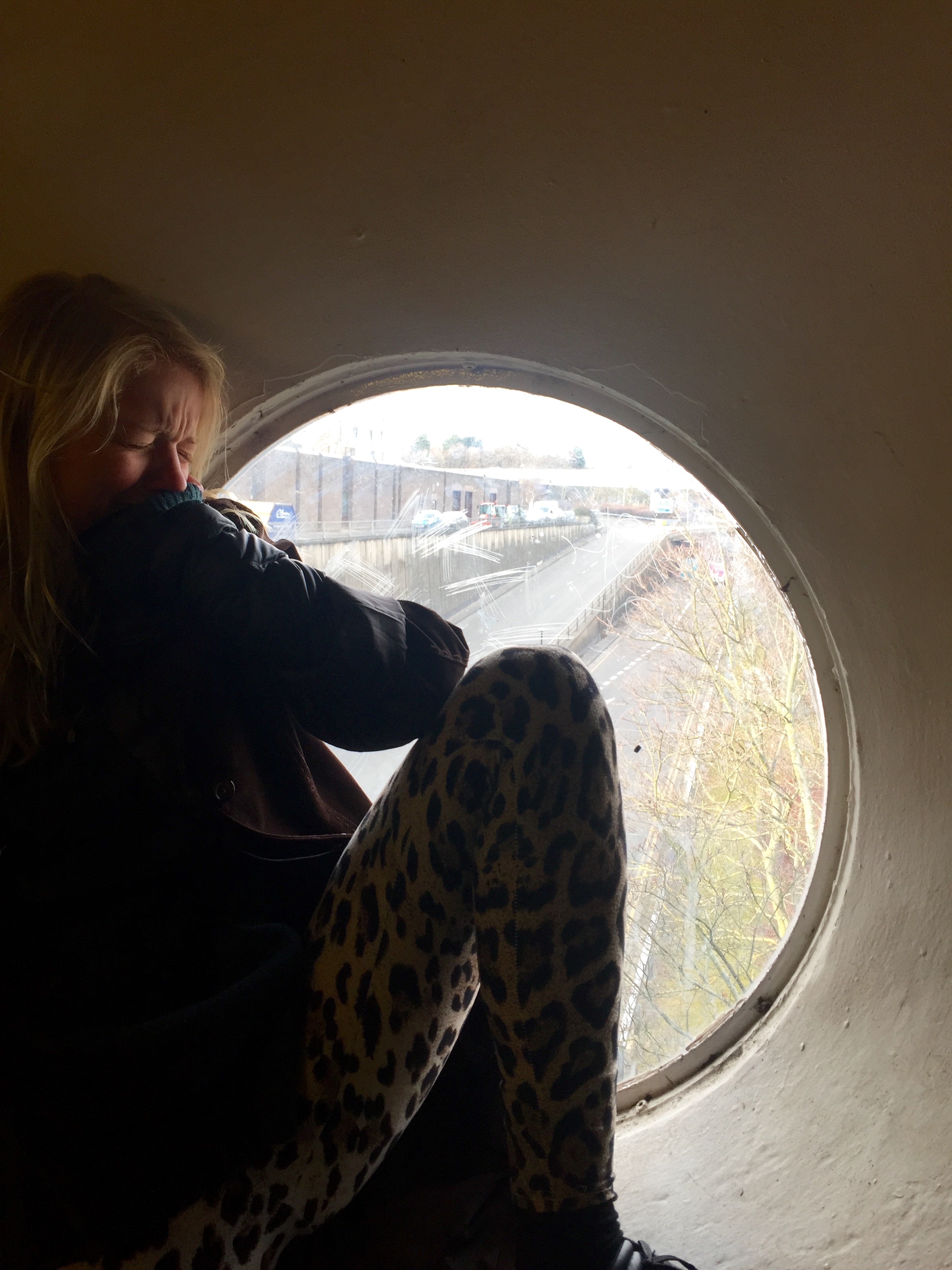 Contemplating smashing through the glass and jumping to the motorway below