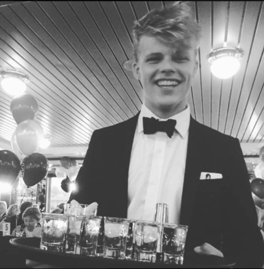 Image may contain: Overcoat, Tuxedo, Suit, Clothing, Human, Person, People