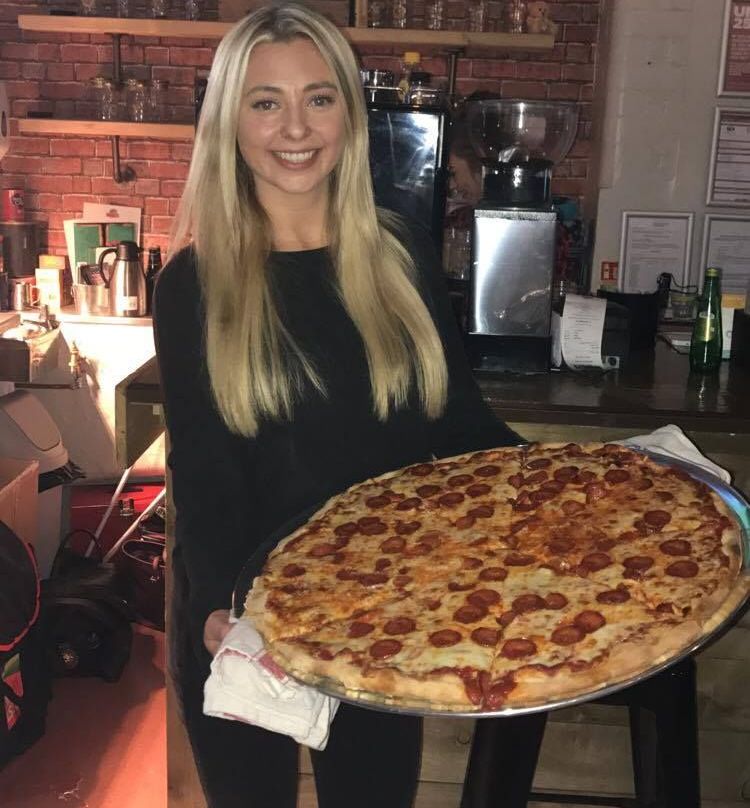 Image may contain: Pizza, Food, Person, People, Human