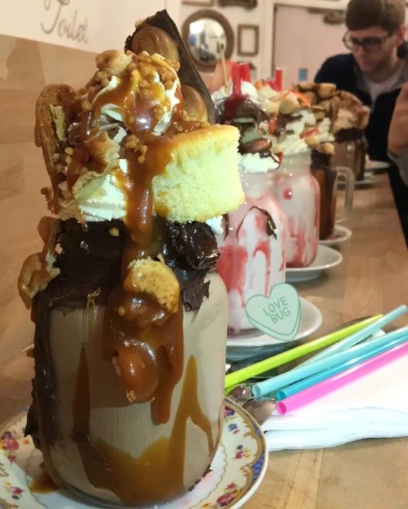 Image may contain: Ice Cream, Bottle, Creme, Cream, Chocolate, Food, Dessert, Cake, Person, People, Human
