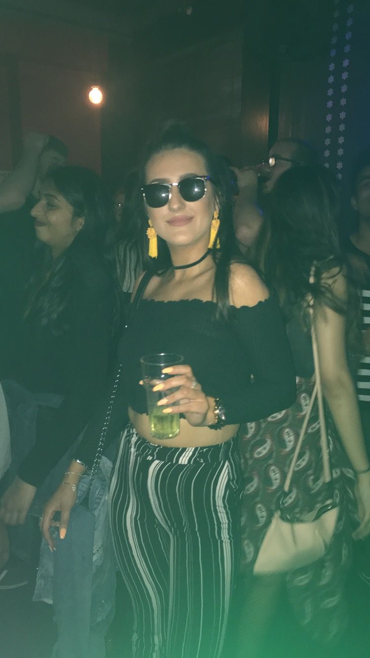 Image may contain: Glass, Night Life, Night Club, Club, Person, People, Human