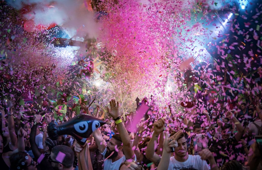 Image may contain: Person, Parade, Human, Crowd, Carnival, Paper, Confetti