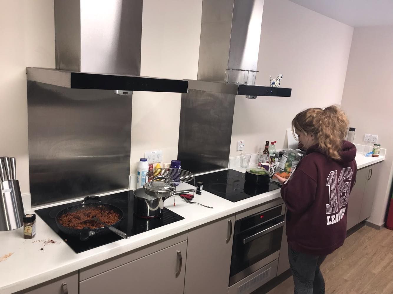 Image may contain: Cooktop, Kitchen, Indoors, Room, Human, Person