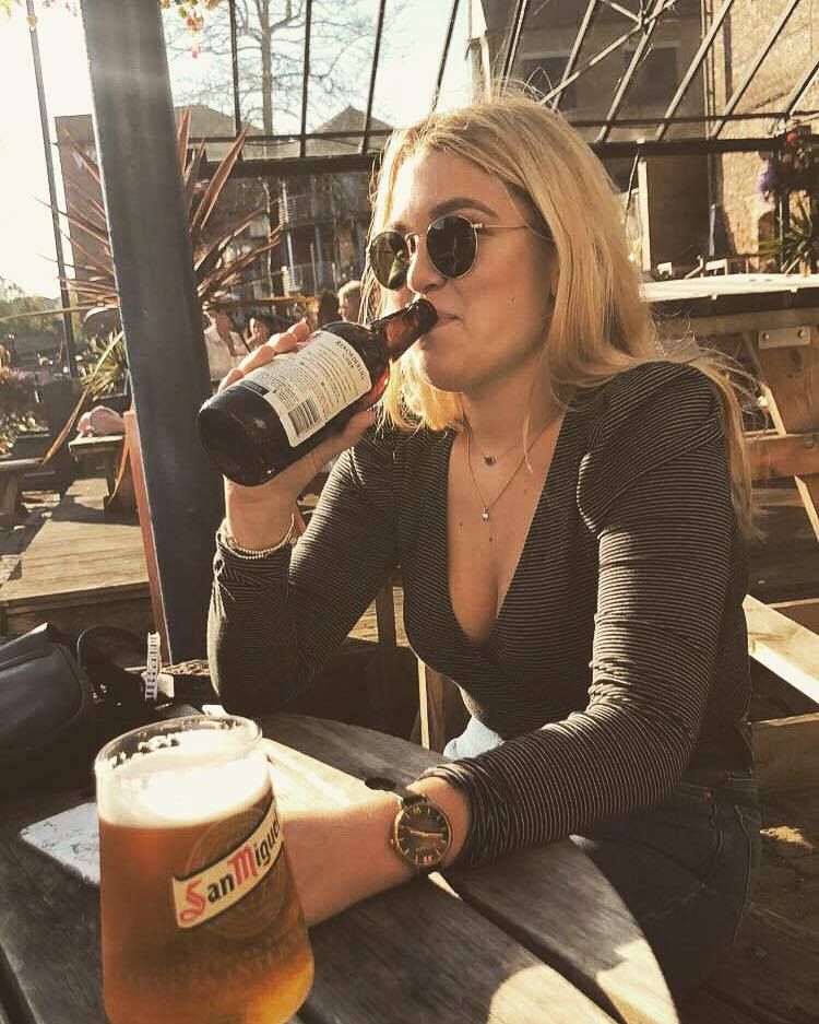 Image may contain: Drinking, Pub, Bar Counter, Glass, Sitting, Woman, Kid, Child, Girl, Female, Teen, Blonde, Dating, Stout, Accessory, Accessories, Sunglasses, Alcohol, Drink, Beverage, Beer, Person, Human