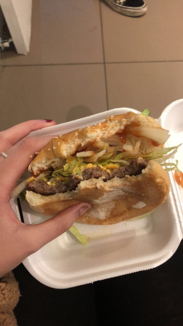 Image may contain: Hot Dog, Pita, Burger, Bread, Food, Human, Person
