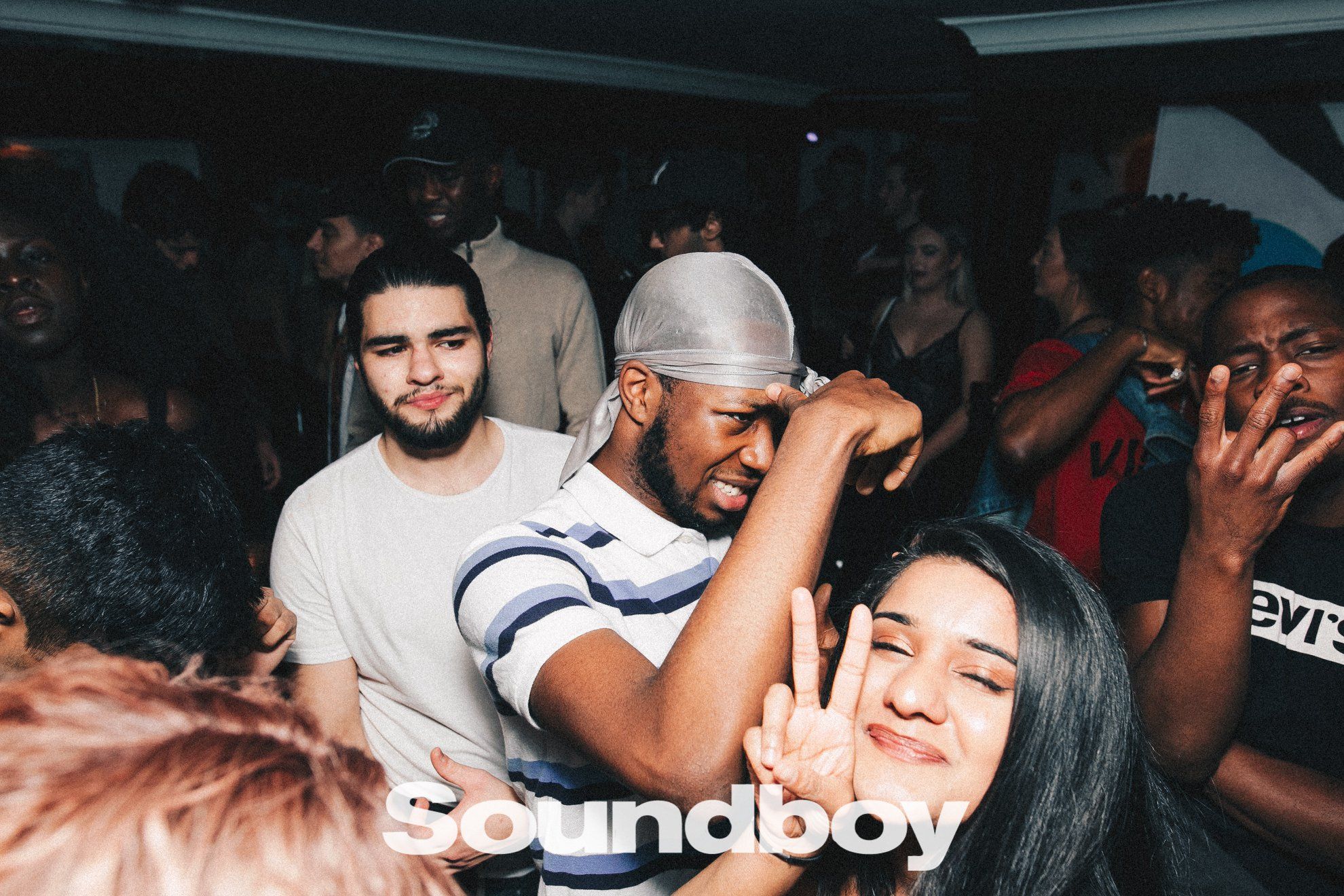 Image may contain: Beard, People, Party, Crowd, Night Club, Club, Face, Human, Person