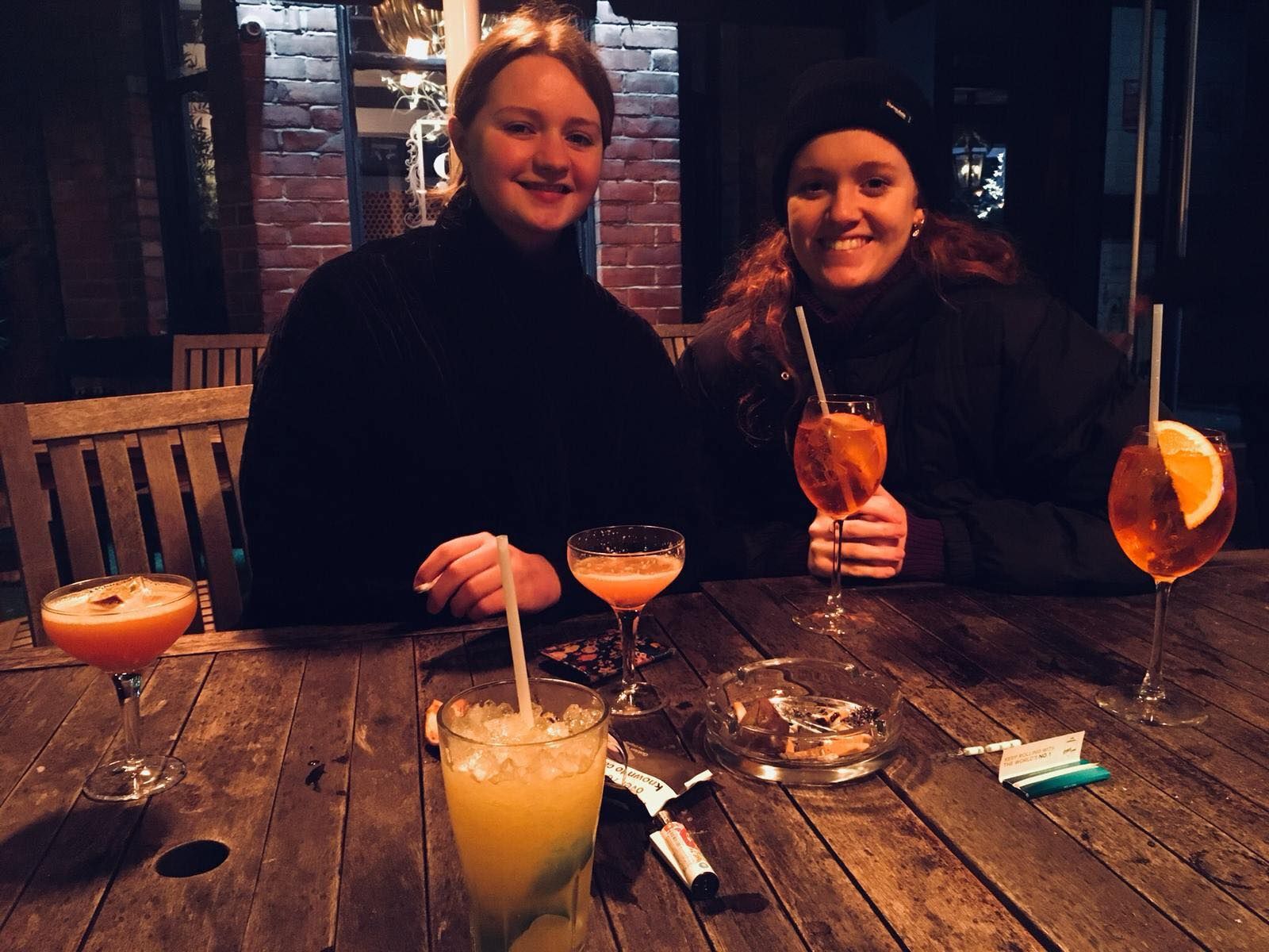 Image may contain: Goblet, Home Decor, Food, Food Court, Chair, Dining Table, Beverage, Cocktail, Drink, Alcohol, Candle, Table, Glass, Restaurant, Furniture, Bar Counter, Pub, Person, Human