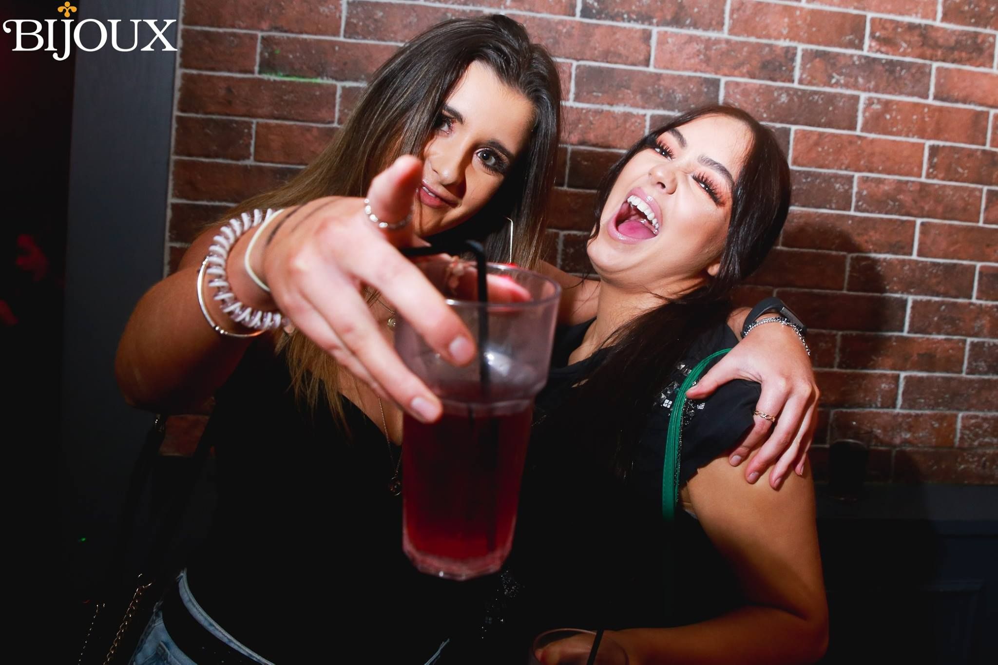 Image may contain: Night Life, Bar Counter, Pub, Alcohol, Beer, Drink, Beverage, Brick, Night Club, Club, Person, Human