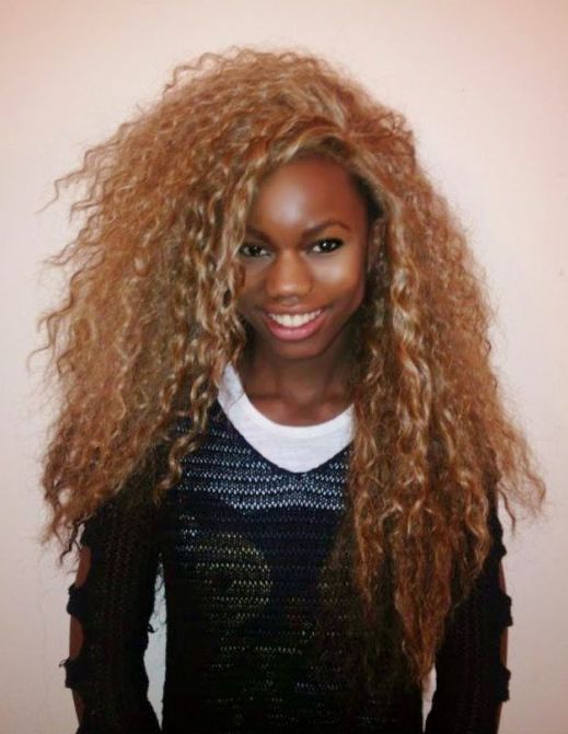 Image may contain: Wig, Afro Hairstyle, Person, Human, Hair