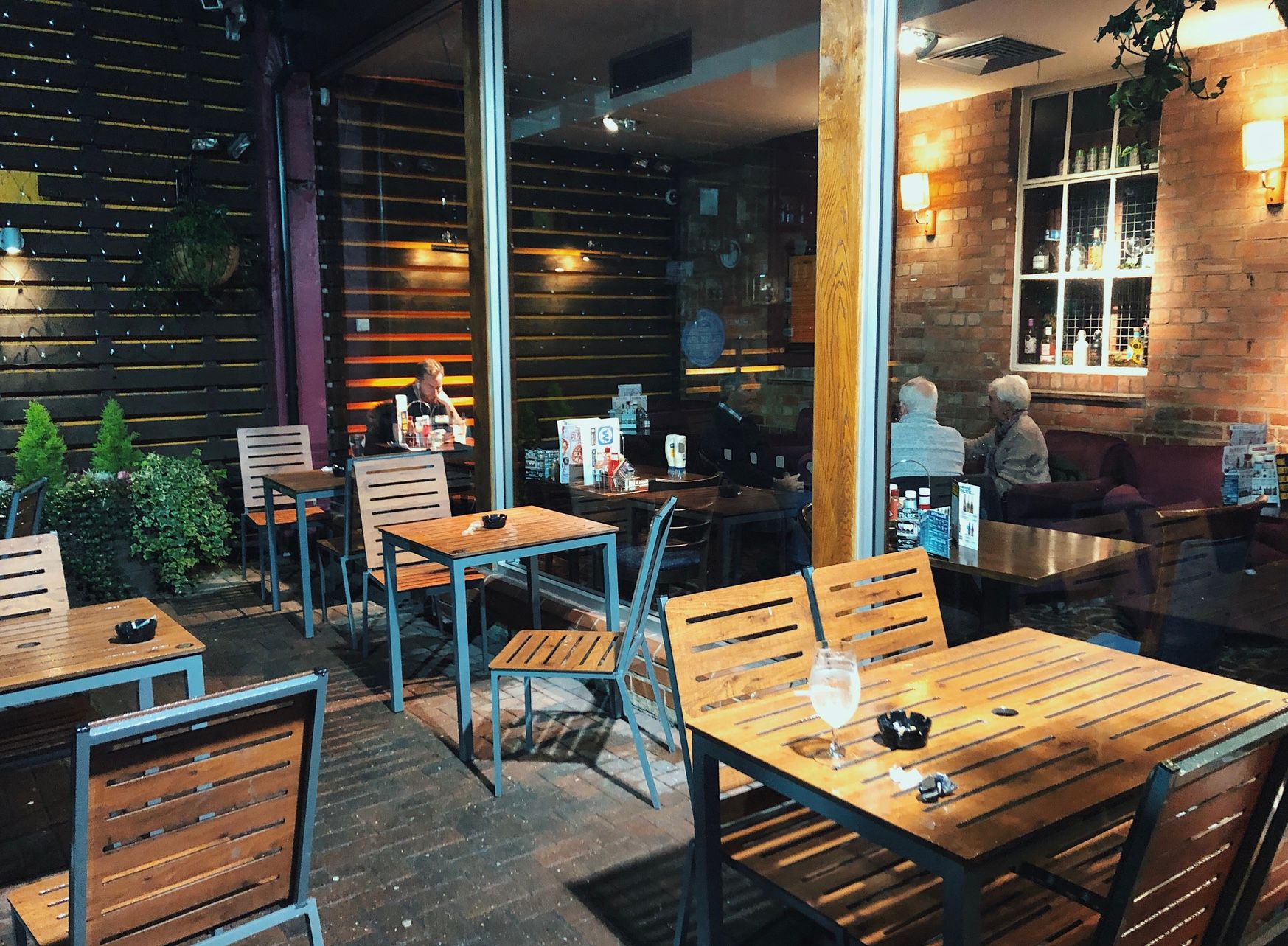 Image may contain: Wood, Cafeteria, Person, Human, Cafe, Furniture, Chair, Restaurant