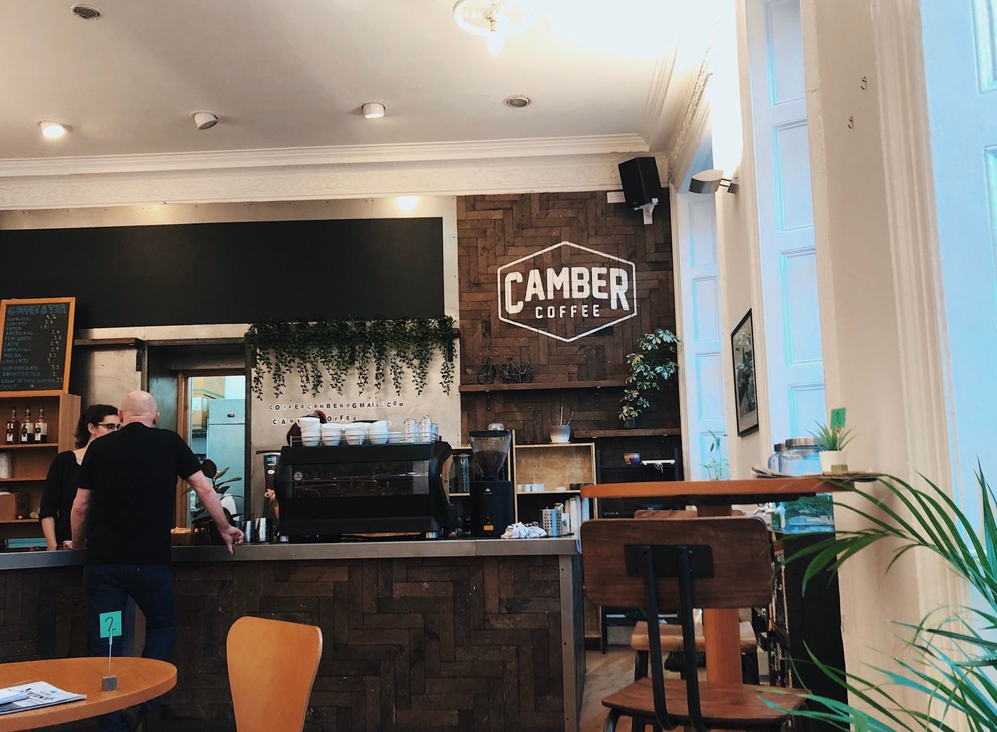 Image may contain: Bar Counter, Plywood, Pub, Cafeteria, Wood, Cafe, Human, Person, Restaurant