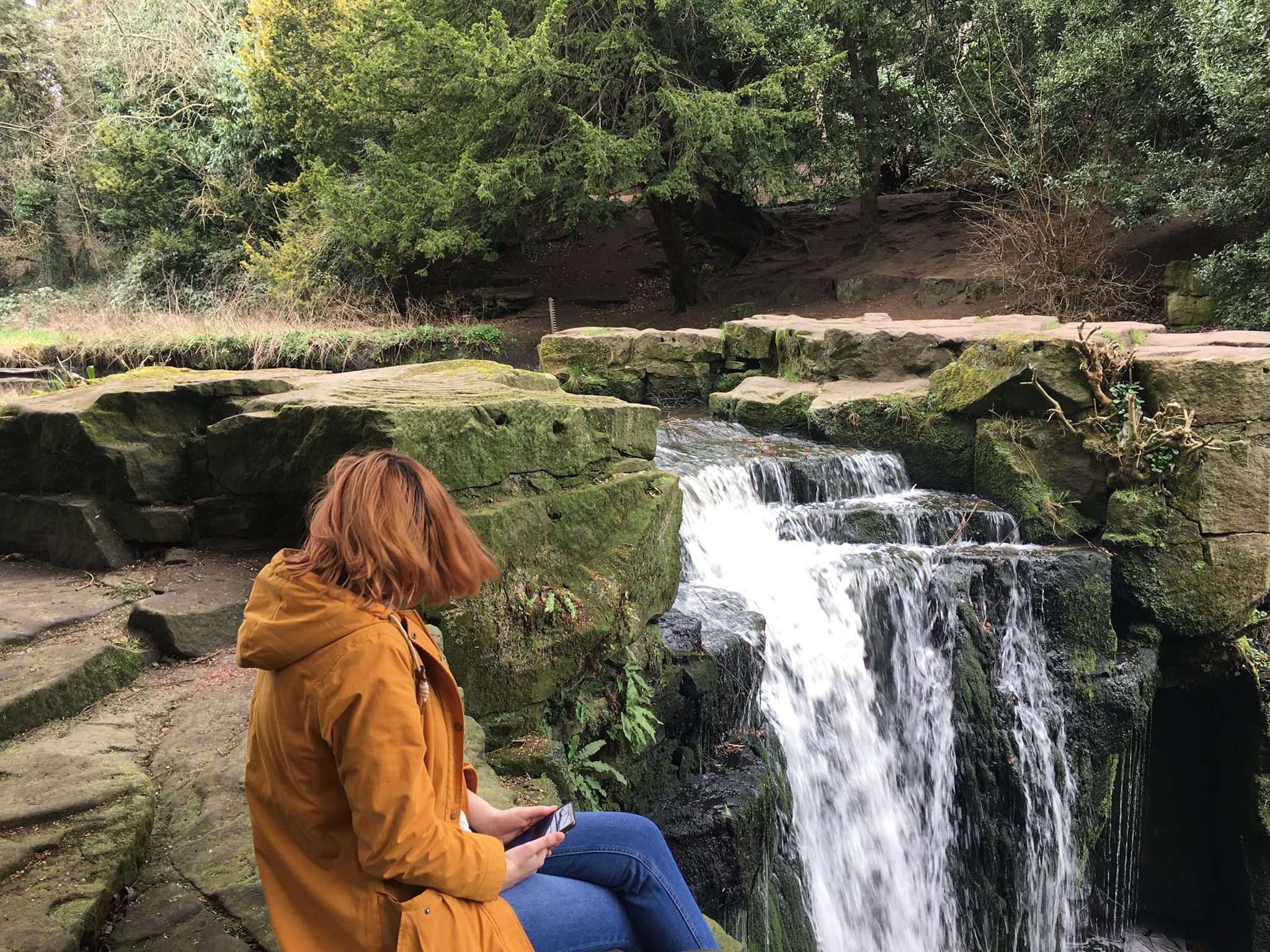 Image may contain: Denim, Jeans, Coat, Human, Person, Pants, Waterfall, Clothing, Apparel, River, Nature, Outdoors, Water
