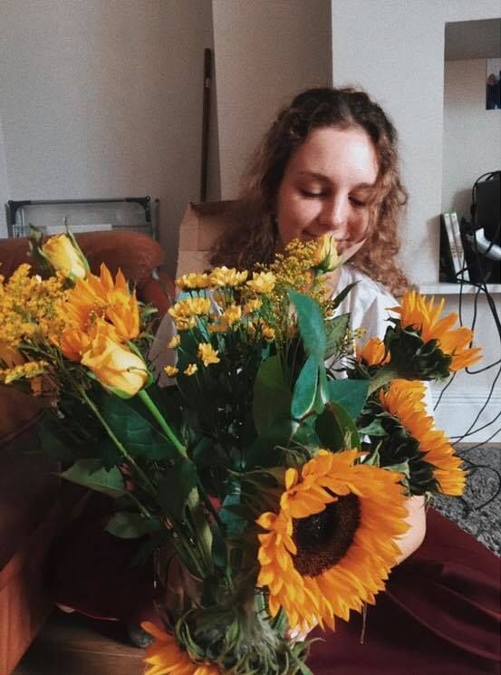 Image may contain: Jar, Flower Bouquet, Flower Arrangement, Blossom, Flower, Human, Person, Plant