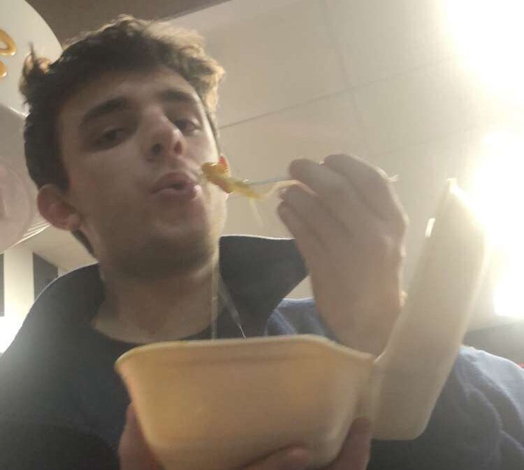 Image may contain: Man, Photography, Photo, Portrait, Eating, Food, Face, Human, Person