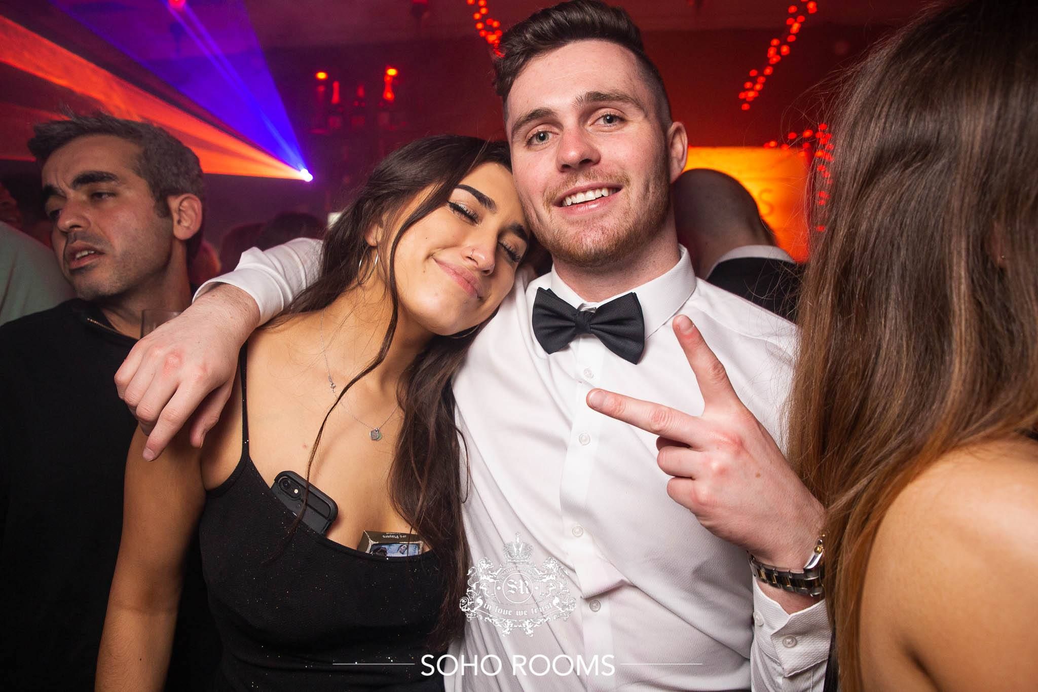 Image may contain: Night Life, Tie, Accessories, Accessory, Night Club, Club, Human, Person