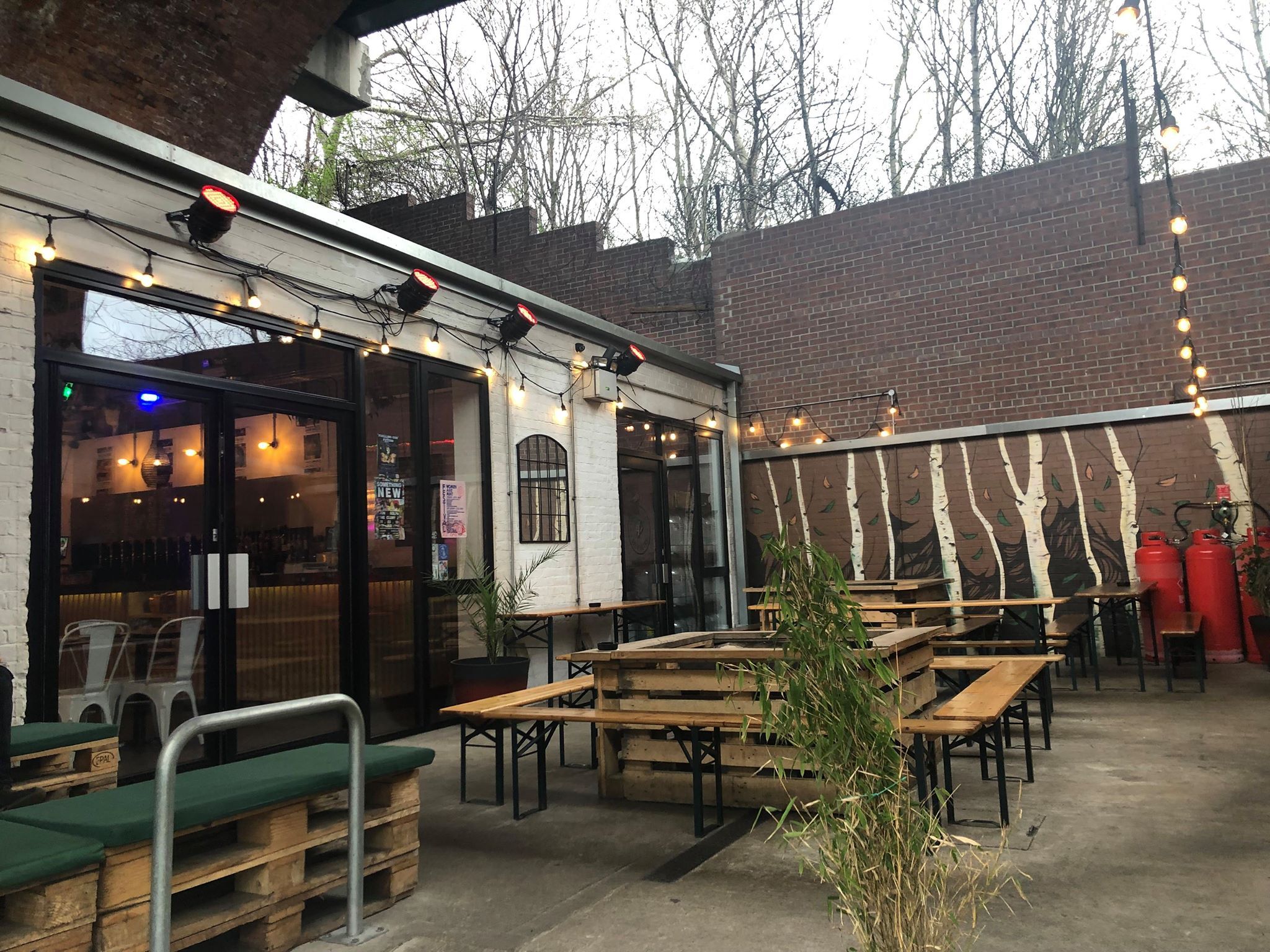 Image may contain: Restaurant, Plywood, Pergola, Porch, Wood, Patio