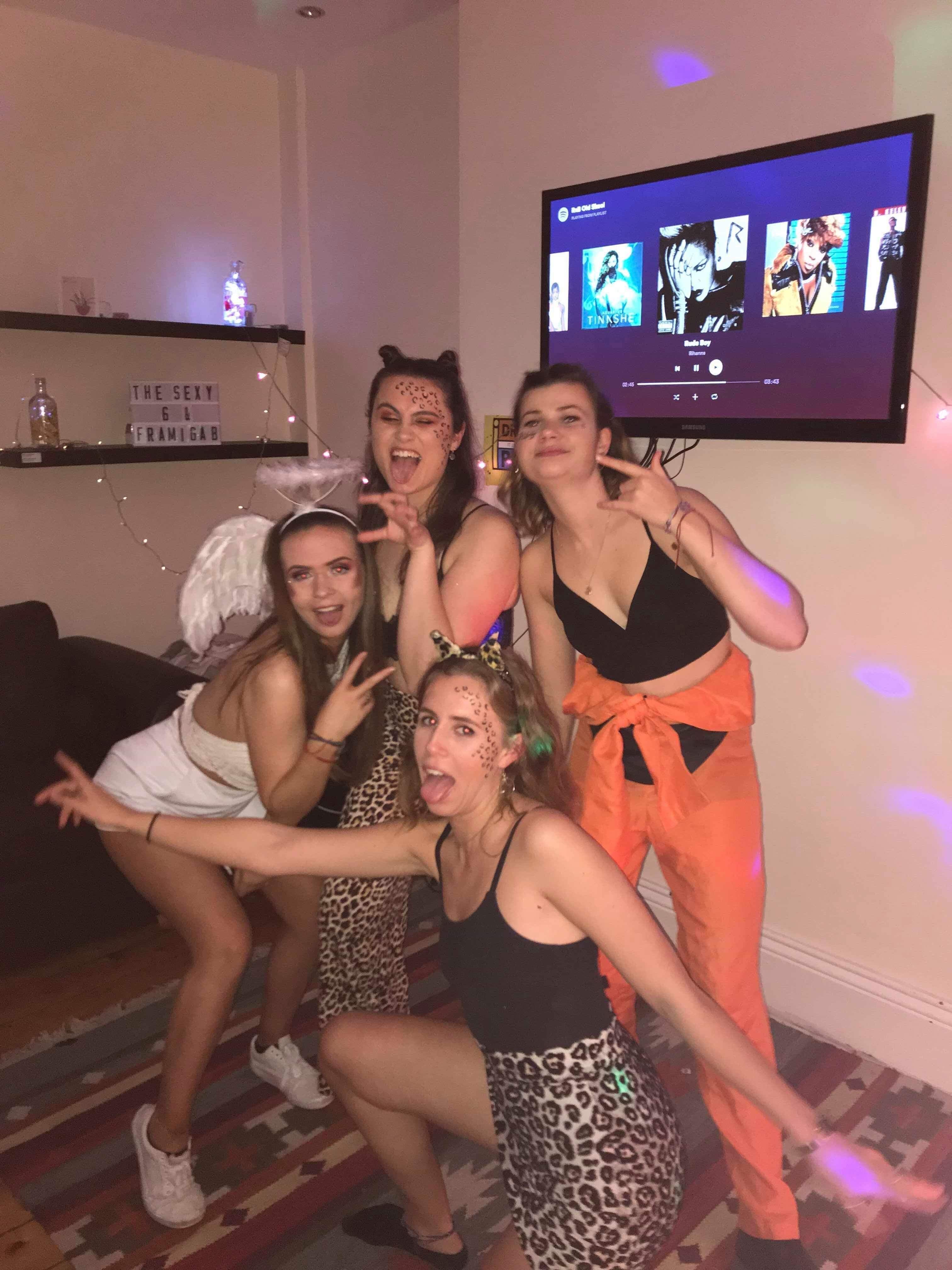 Image may contain: Night Life, Club, Television, TV, Leisure Activities, Footwear, Shoe, Evening Dress, Robe, Fashion, Gown, Indoors, Interior Design, Display, Screen, Electronics, Monitor, Clothing, Apparel, Human, Person
