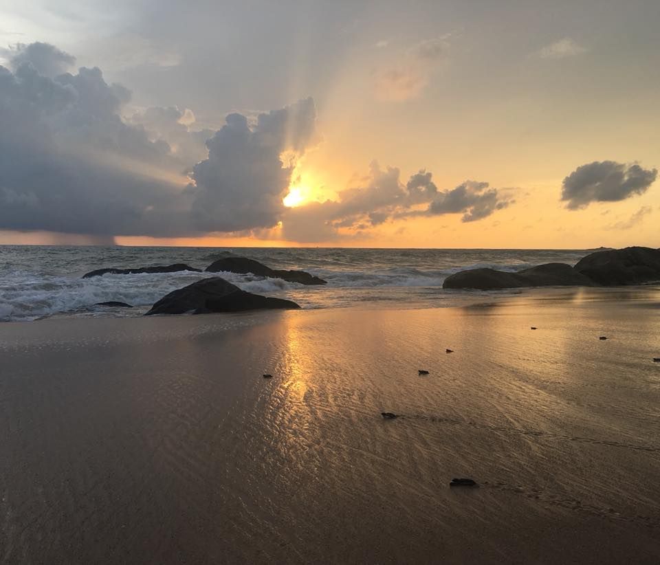 Image may contain: Soil, Sand, Land, Beach, Coast, Weather, Ocean, Sea, Flare, Light, Red Sky, Dusk, Dawn, Sunset, Water, Shoreline, Sky, Sunlight, Outdoors, Nature