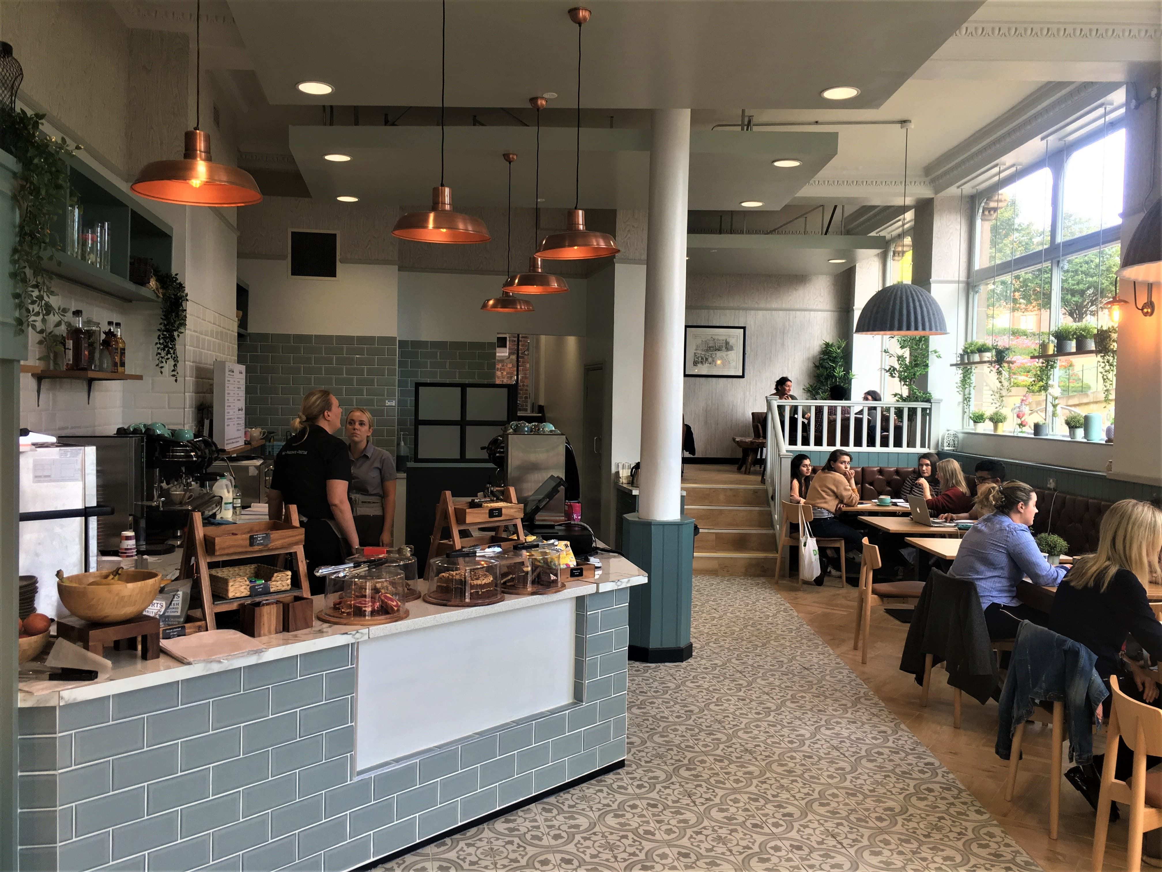 Image may contain: Plywood, Wood, Cafe, Flooring, Cafeteria, Human, Person, Restaurant