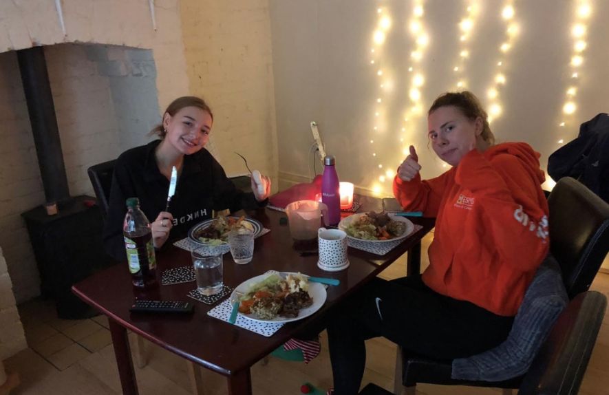 Image may contain: Clothing, Apparel, Beverage, Drink, Restaurant, People, Dinner, Supper, Food, Meal, Face, Dining Room, Chair, Indoors, Room, Human, Person, Dining Table, Table, Furniture