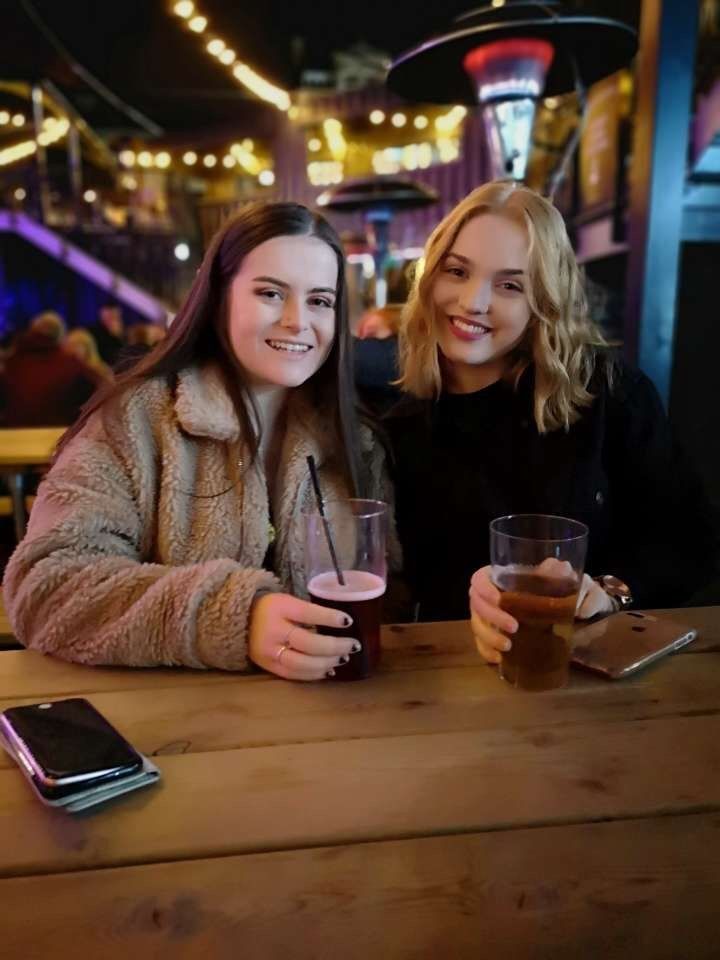 Image may contain: Sitting, Glass, Alcohol, Beer, Bar Counter, Drink, Beverage, Pub, Restaurant, Dating, Phone, Mobile Phone, Electronics, Cell Phone, Person, Human