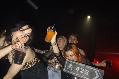 Image may contain: Beverage, Drinking, Drink, Night Club, Club, Night Life, Human, Person