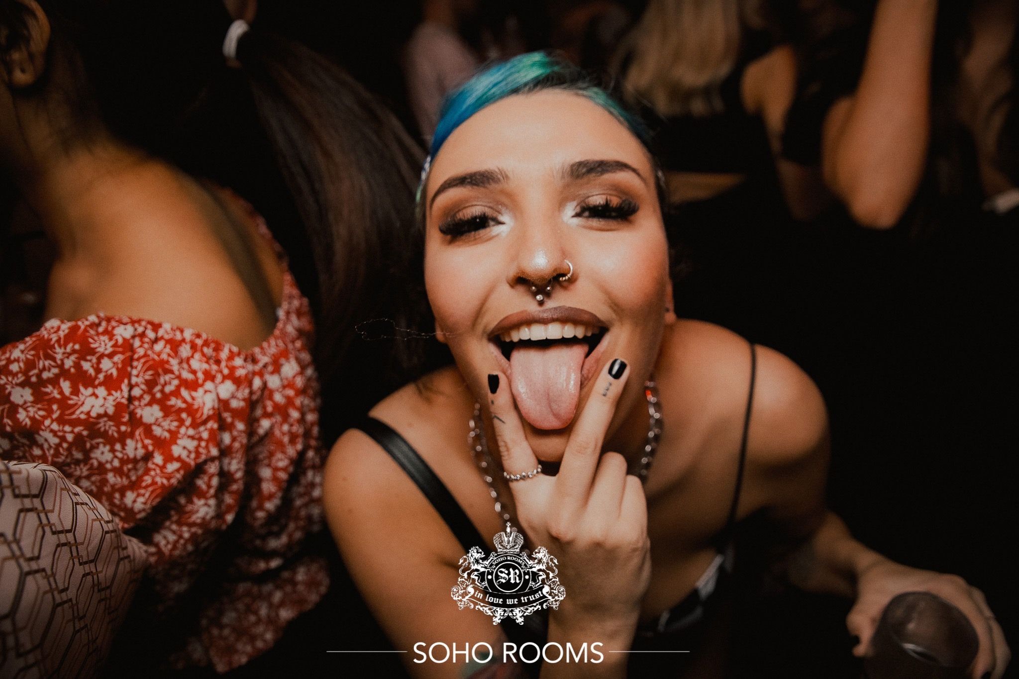 Image may contain: Night Club, Club, Lip, Mouth, Finger, Human, Person