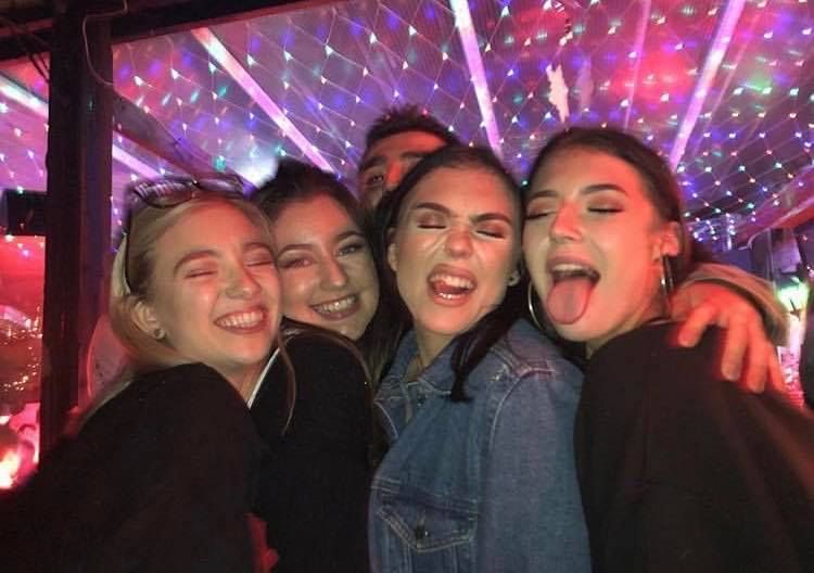 Image may contain: People, Jeans, Denim, Female, Photo, Photography, Portrait, Teeth, Lip, Mouth, Night Life, Pants, Apparel, Clothing, Night Club, Club, Party, Lighting, Smile, Face, Human, Person