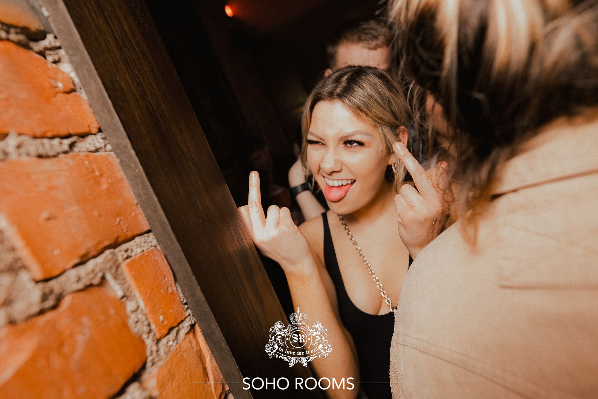 Image may contain: Accessory, Accessories, Burger, Food, Finger, Night Life, Brick, Person, Human