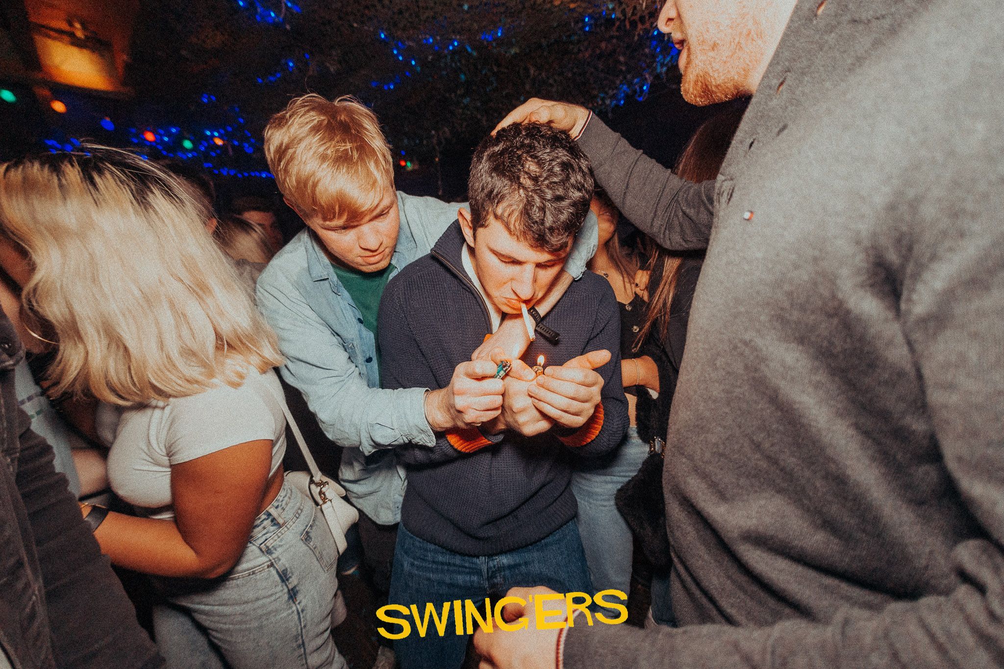 Image may contain: Finger, Night Life, Club, Night Club, Person, Human
