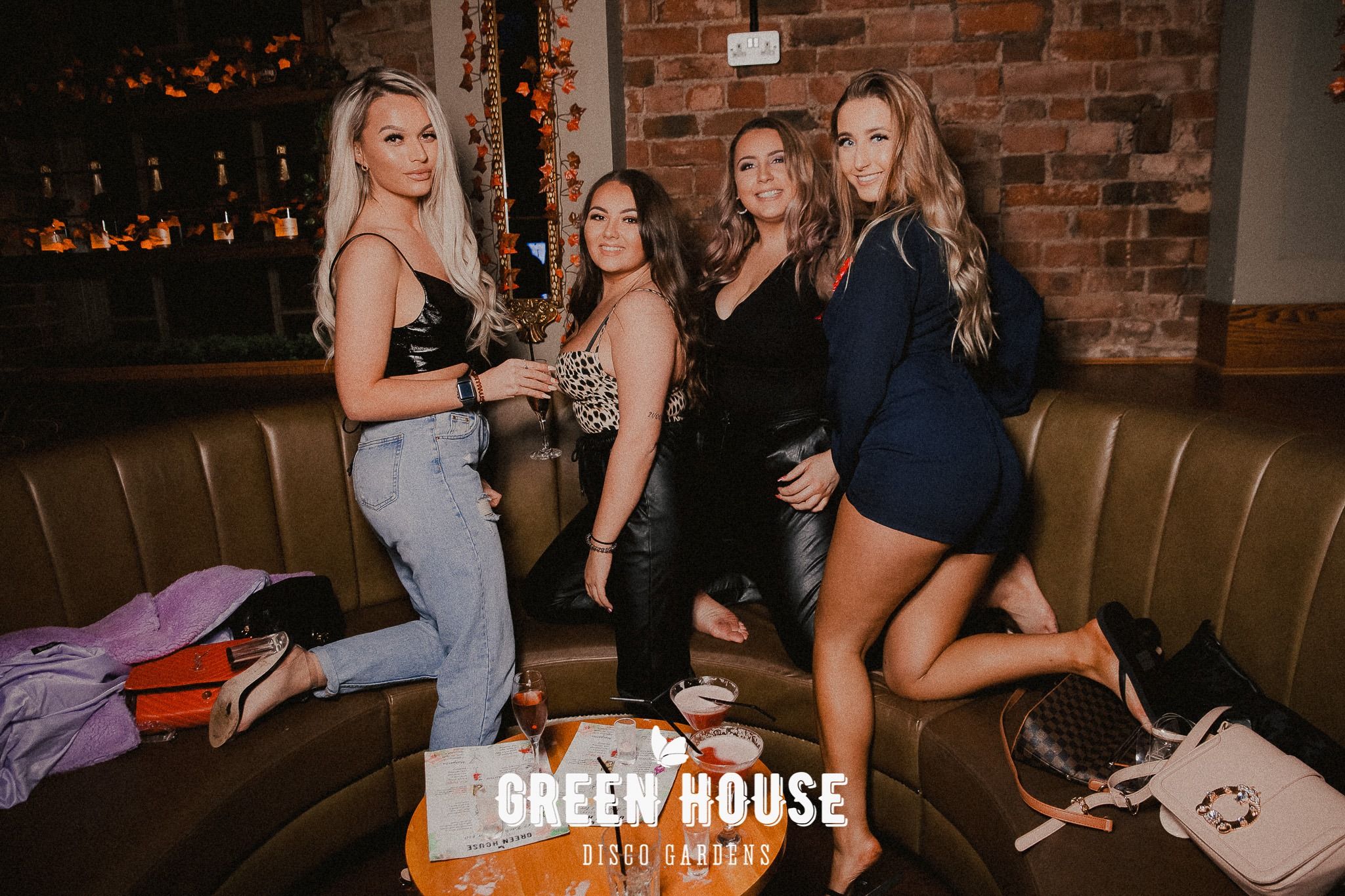 Image may contain: Night Club, Clothing, Apparel, Club, Bar Counter, Pub, Couch, Furniture, Human, Person