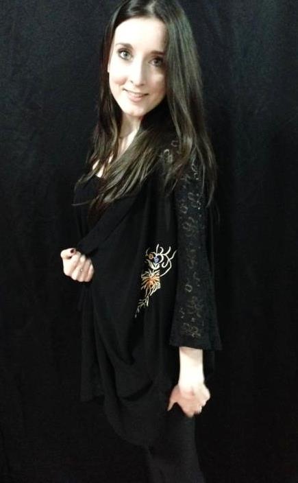 This black chiffon kimono has lace panels at the sides, and a colourful embroidery on the front. It's very light-weight and comfortable, introducing different materials and a little colour to an all-black outfit. Kimono- Ruby Room
