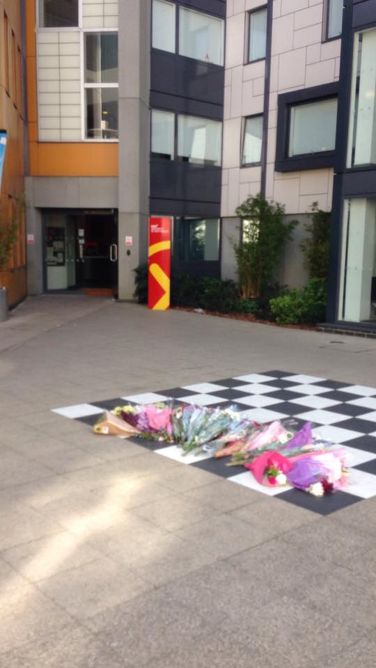 Flower tributes have been placed outside INTO