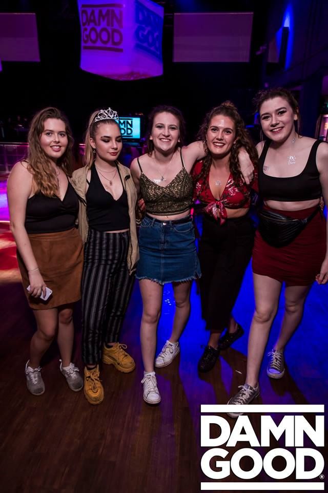 Image may contain: Woman, Night Life, Skirt, Female, Night Club, Club, Shoe, Footwear, Clothing, Apparel, Human, Person