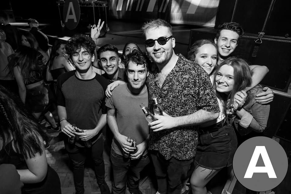 Image may contain: Audience, Leisure Activities, Crowd, Night Club, Apparel, Clothing, Skin, Night Life, Club, Face, Sunglasses, Accessory, Accessories, Party, Person, Human