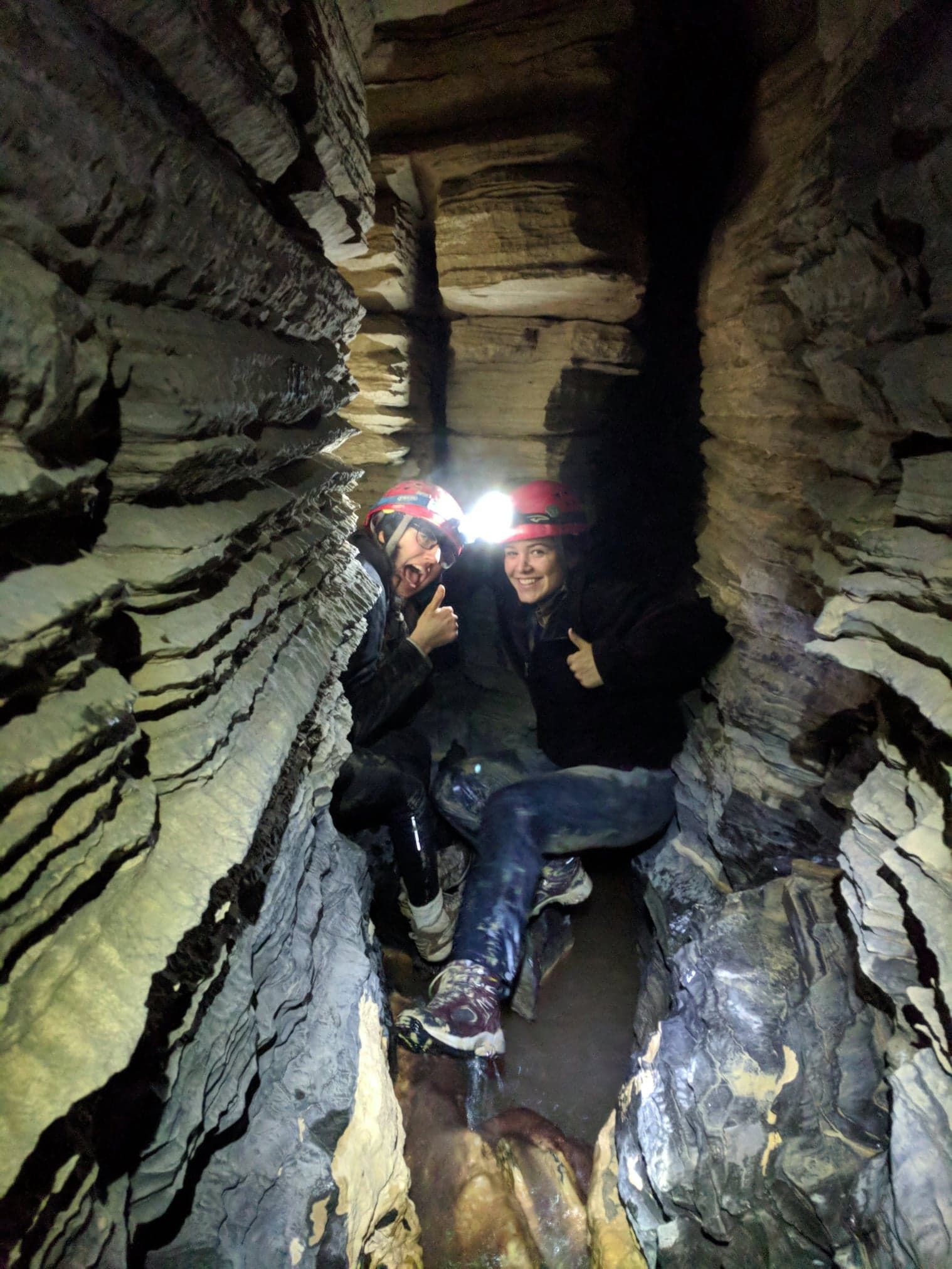 Image may contain: Outdoors, Cave, Person, Human, Apparel, Clothing, Helmet, Nature