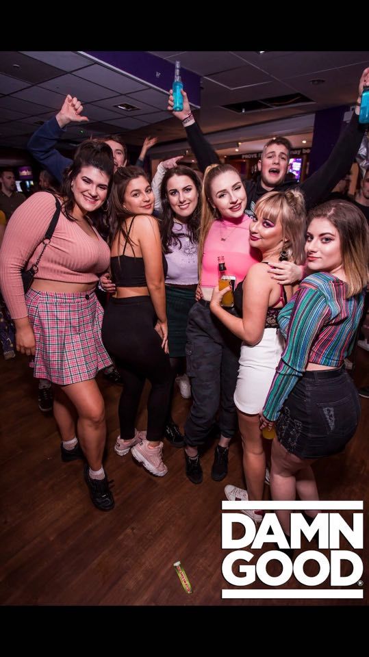 Image may contain: People, Skirt, Face, Female, Night Club, Club, Footwear, Shoe, Clothing, Apparel, Party, Human, Person