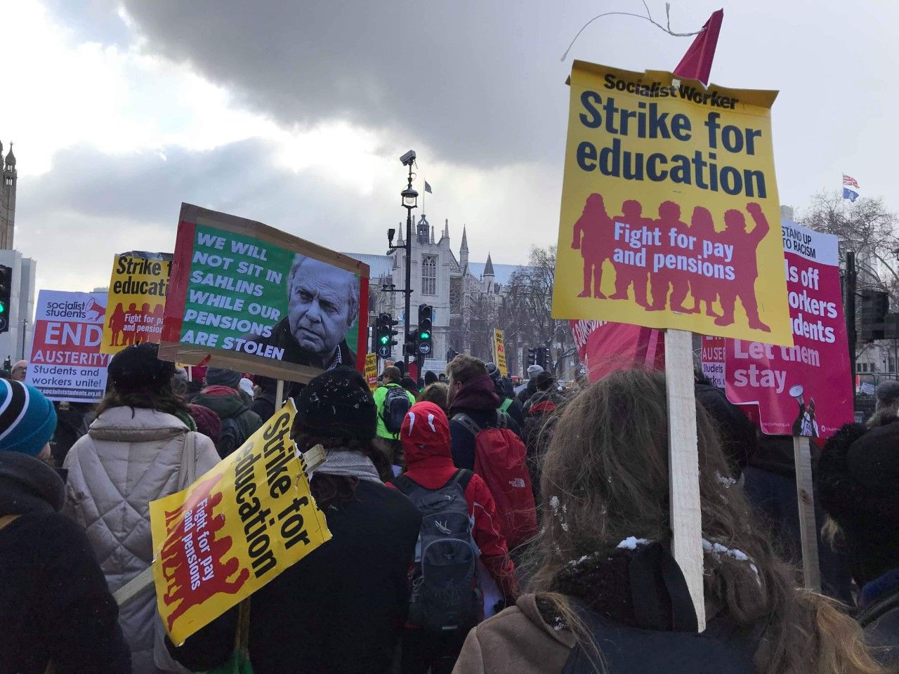 Image may contain: Protest, Parade, Crowd, Person, Human, Text, Banner