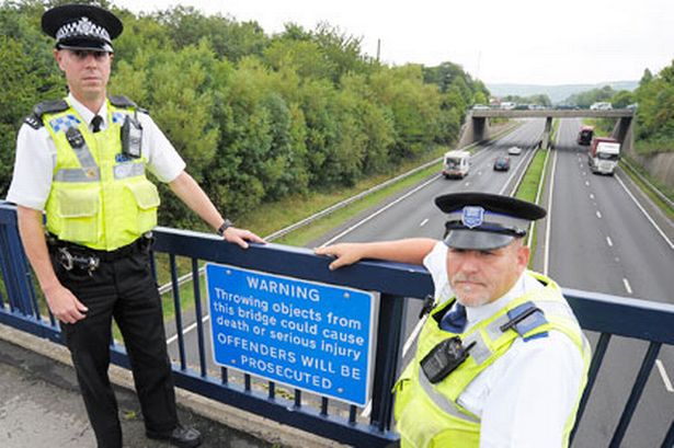 pc-paul-brown-and-pcso-stephen-cook-are-shown-on-the-bridge-over-the-a174-485702806-3619504