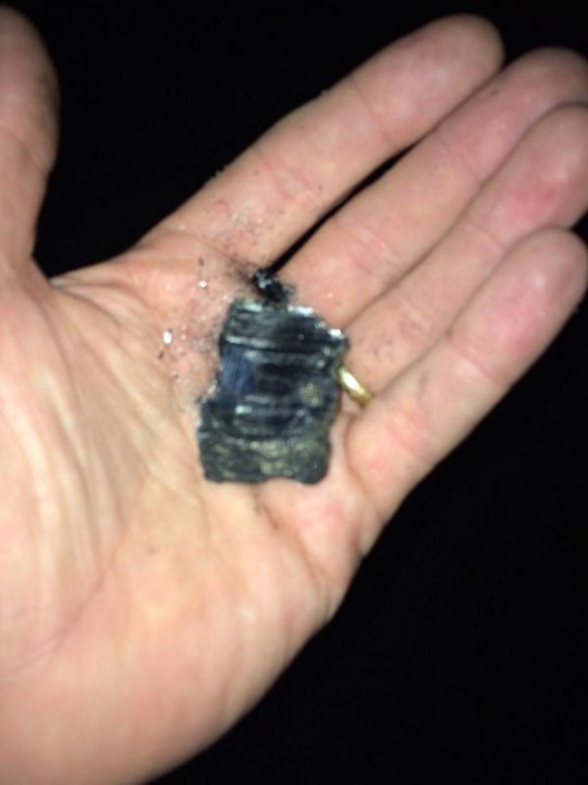 Local residents saw pieces of charcoal fall from the sky