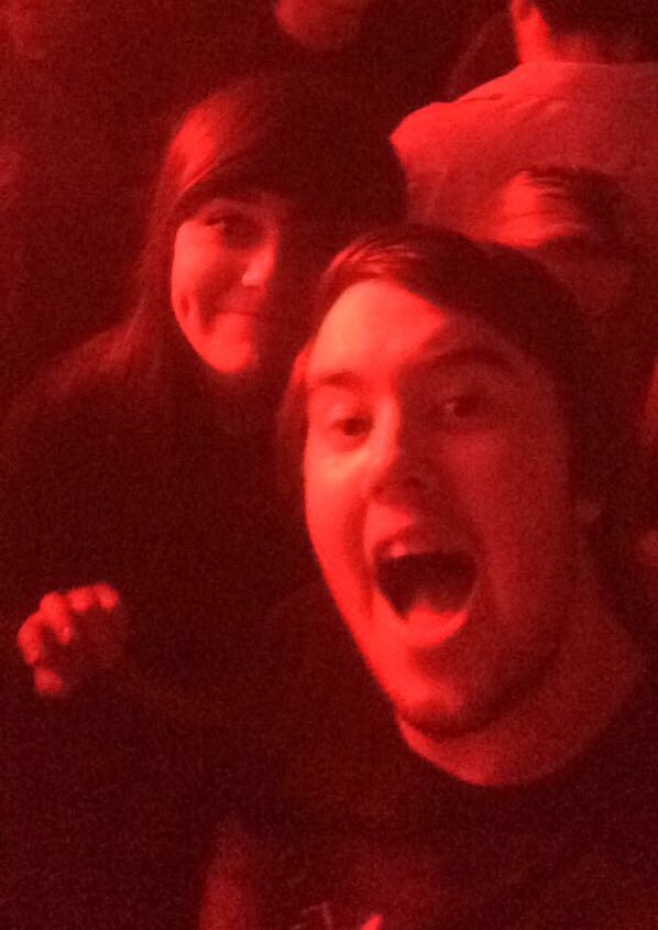 A forced smile so everybody on social media knows you're having the 'SICKEST NIGHT!!!" 