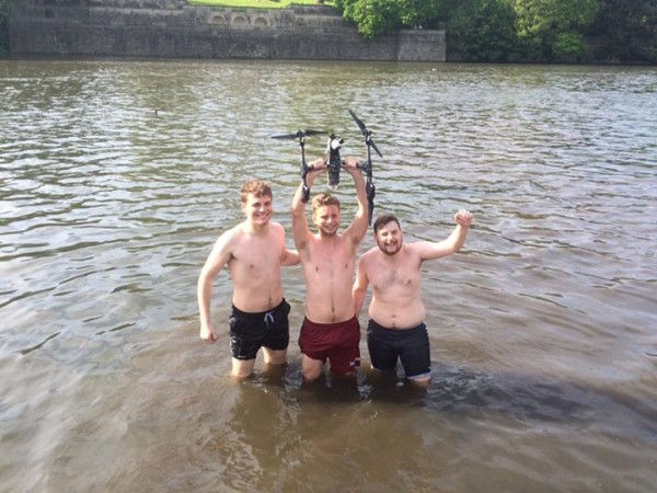 George, James and Adam pose triumphantly in the lake