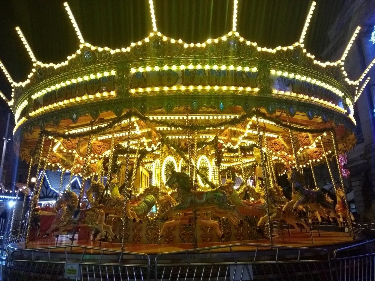Image may contain: Carousel, Lamp, Chandelier, Theme Park, Amusement Park