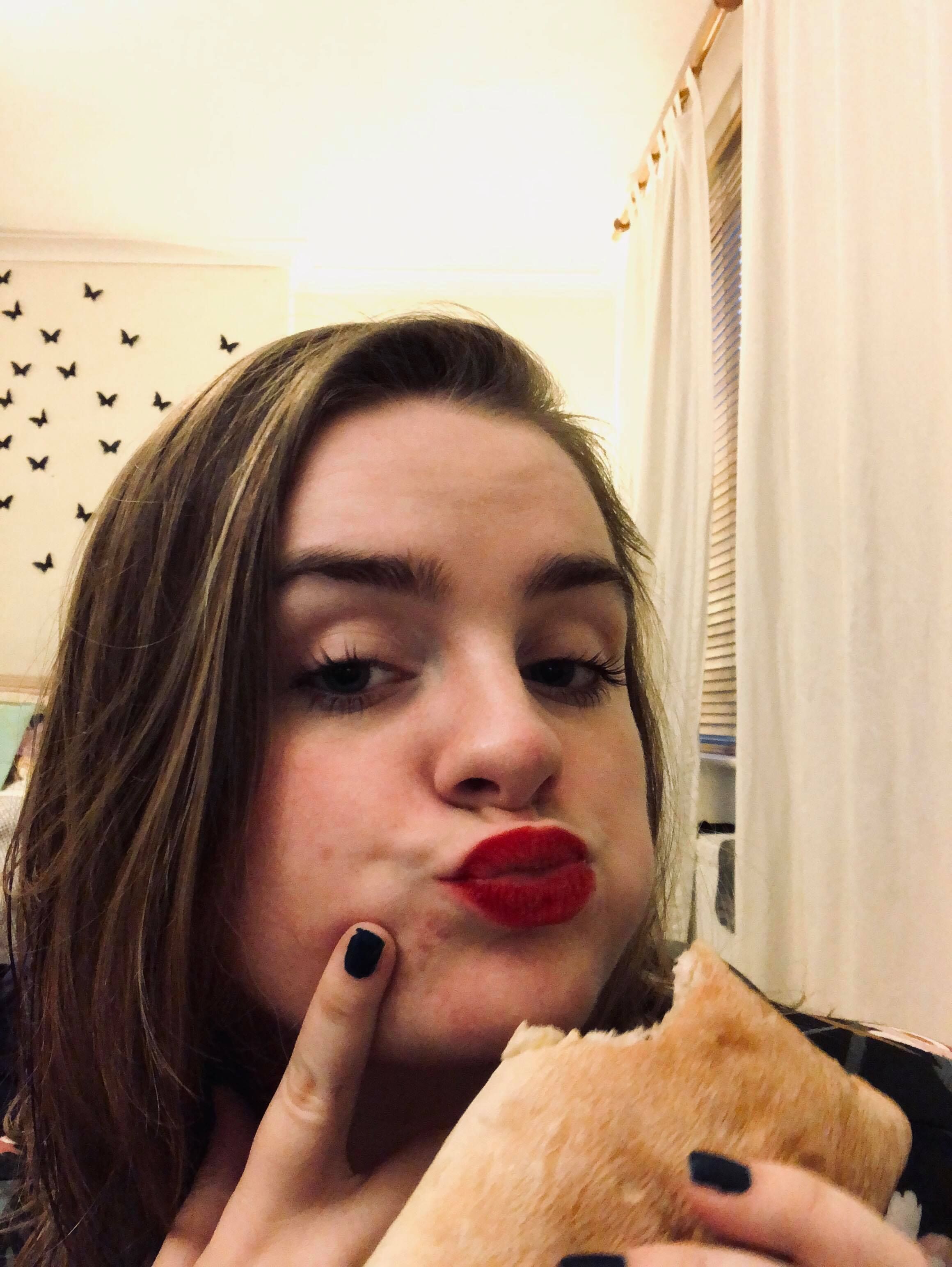 Image may contain: Finger, Bread, Food, Lipstick, Cosmetics, Bird, Animal, Person, Human