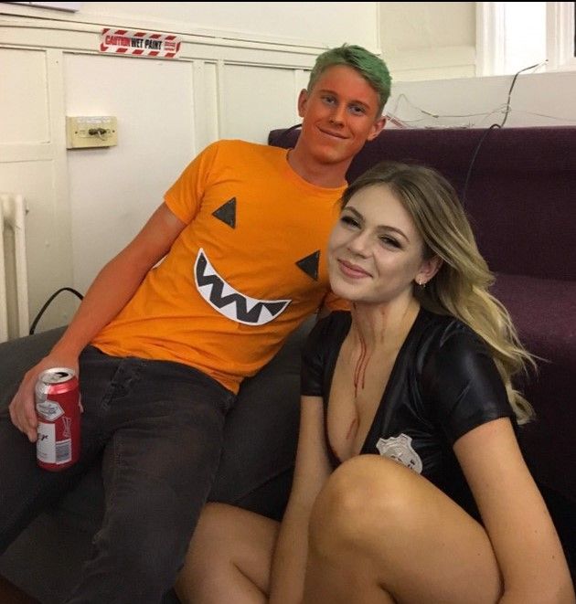 Image may contain: Smile, Portrait, Face, Furniture, Couch, Bottle, Person, People, Human