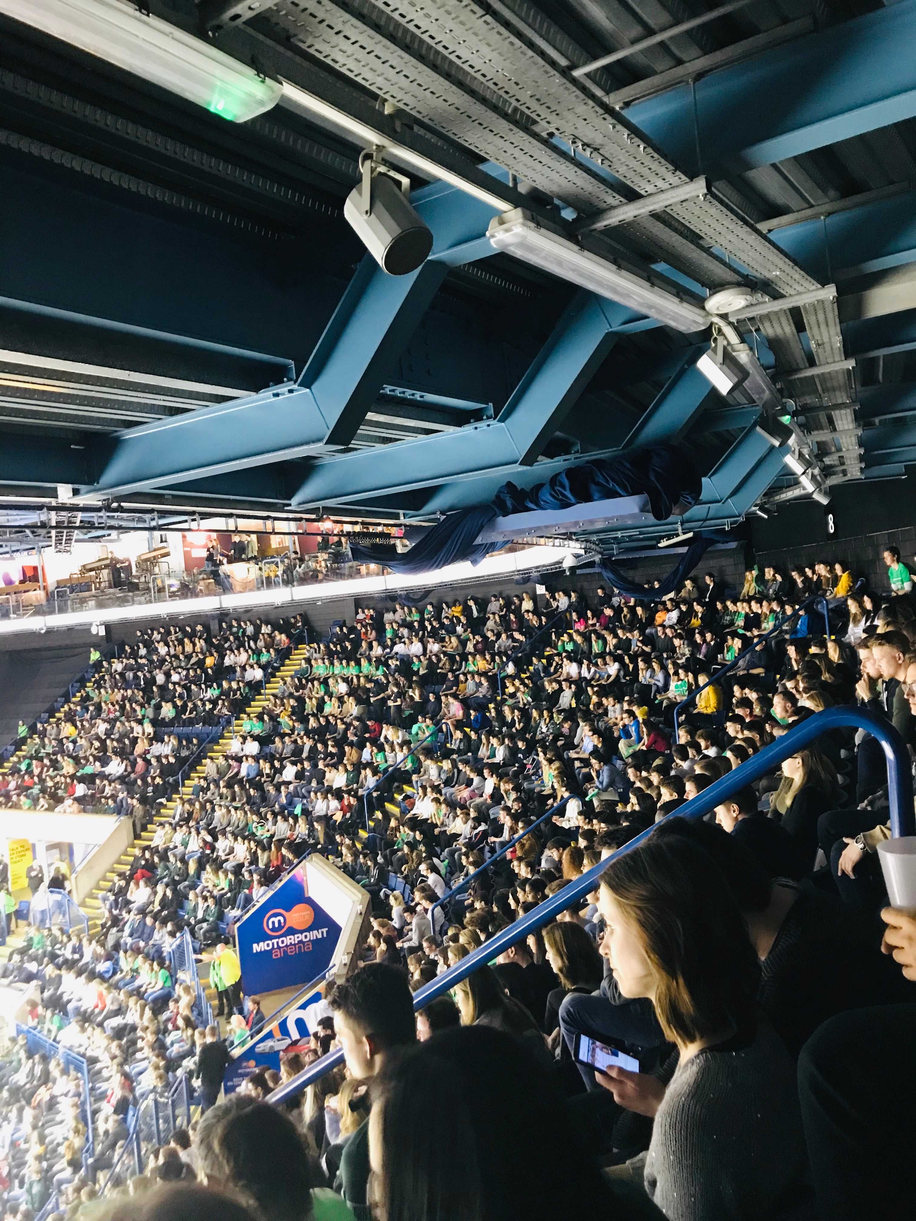Image may contain: Stadium, Airplane, Vehicle, Aircraft, Transportation, Architecture, Arena, Crowd, Audience, Building, Human, Person