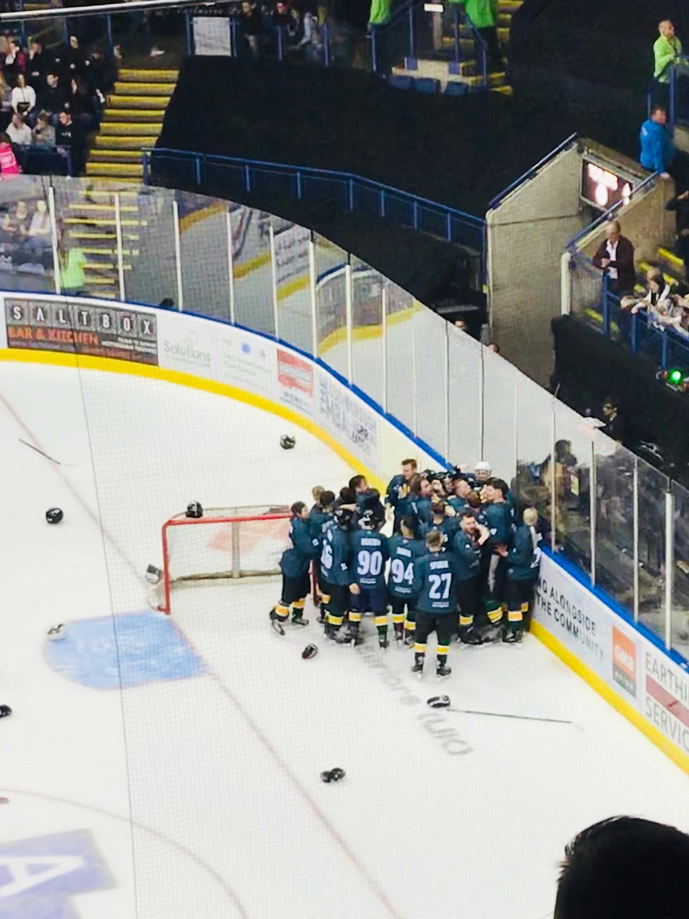 Image may contain: Team Sport, Ice Hockey, Team, Huddle, People, Crowd, Skating, Ice Skating, Sport, Sports, Rink, Human, Person