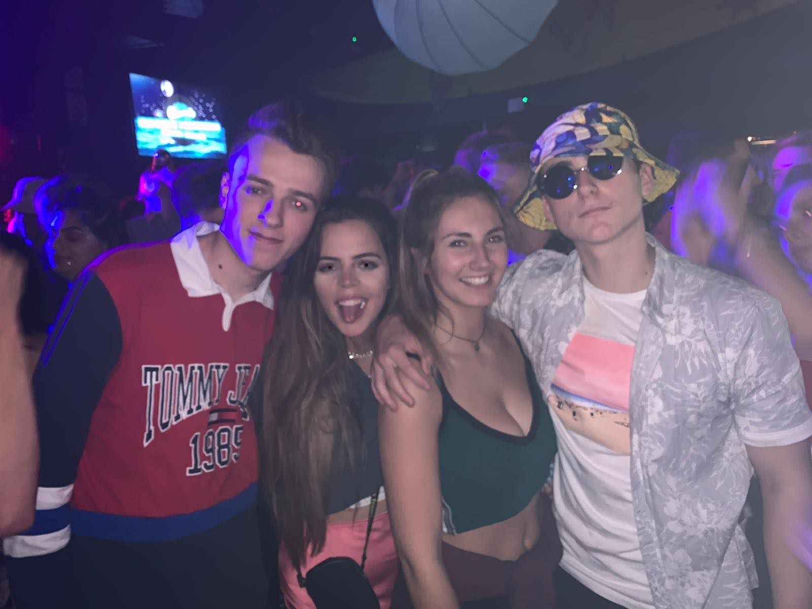Image may contain: Apparel, Clothing, Hat, Night Life, Night Club, Club, Party, Accessories, Sunglasses, Accessory, Person, Human